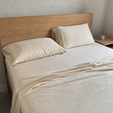 Natural bamboo sheets on a real timber bed
